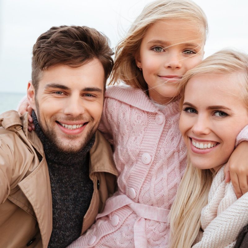 portrait-happy-family-with-little-daughter_171337-7180